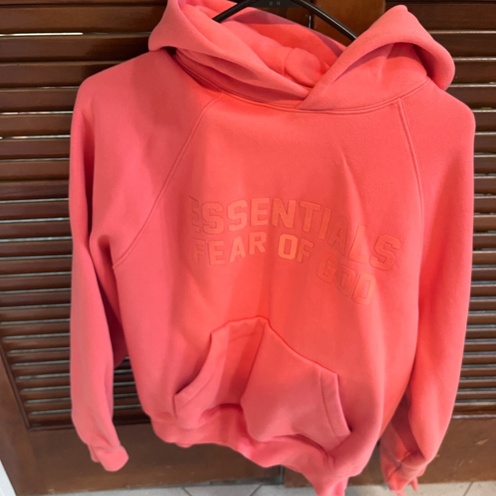 Fear of god essentials hoodie , coral
